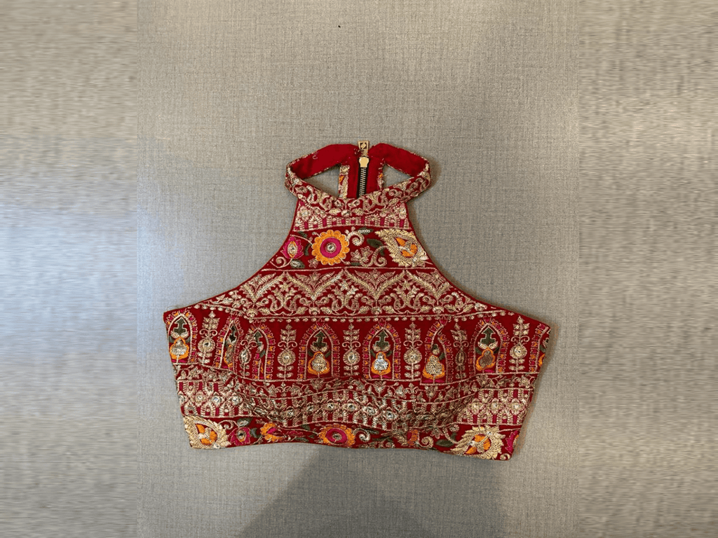 Buy beautiful red heavy embroidery halter neck saree blouse online in USA. Elevate your saree style with exquisite readymade saree blouses, embroidered saree blouses, Banarasi saree blouse, designer saree blouse, choli-cut blouses, corset blouses from Pure Elegance Indian clothing store in USA.-full view