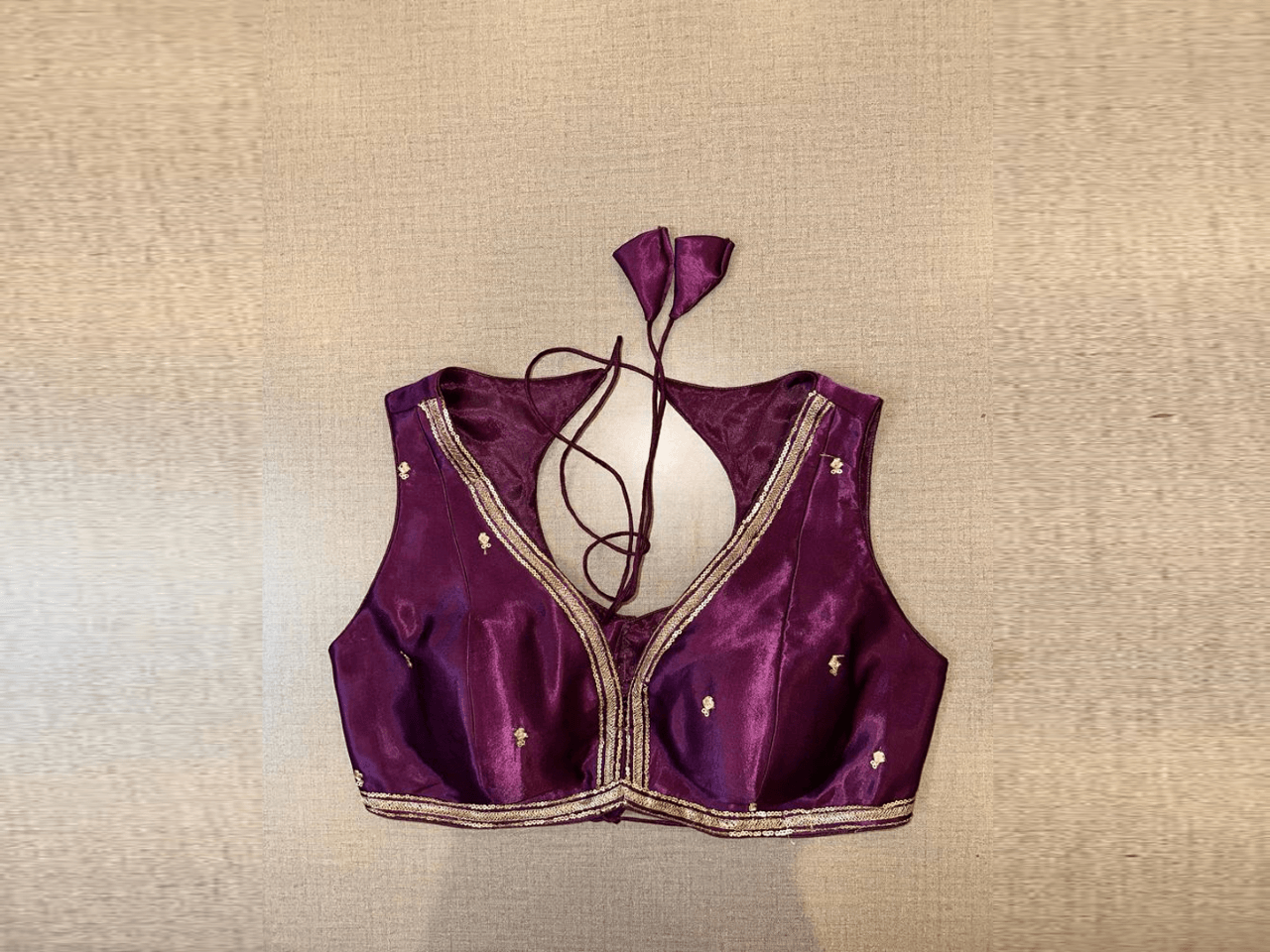 Buy beautiful purple sleeveless saree blouse online in USA with embroidered butis. Elevate your saree style with exquisite readymade saree blouses, embroidered saree blouses, Banarasi saree blouse, designer saree blouse, choli-cut blouses, corset blouses from Pure Elegance Indian clothing store in USA.-full view