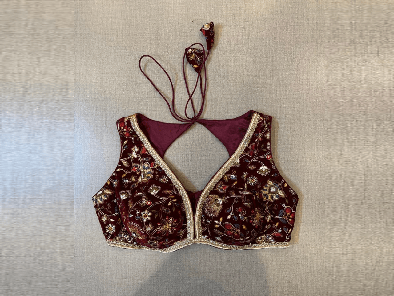 Buy wine color heavy embroidery velvet saree blouse online in USA. Elevate your saree style with exquisite readymade saree blouses, embroidered saree blouses, Banarasi saree blouse, designer saree blouse, choli-cut blouses, corset blouses from Pure Elegance Indian clothing store in USA.-full view