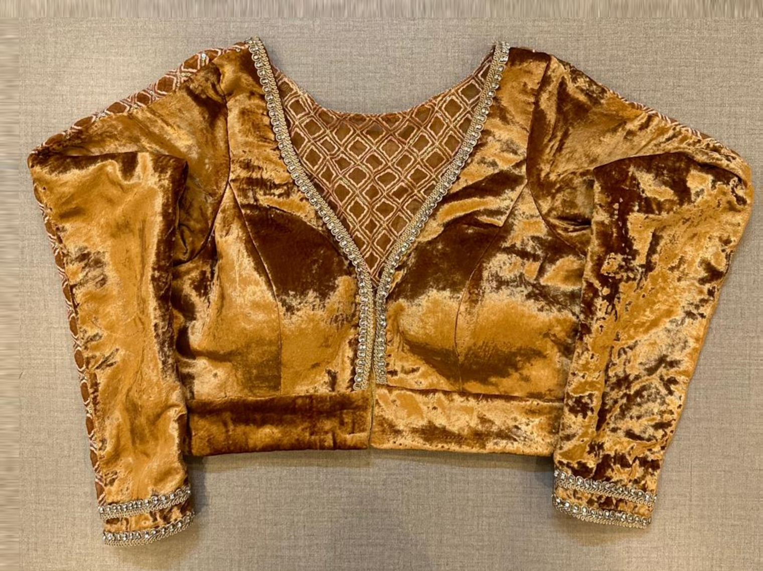 Shop golden velvet saree blouse online in USA with sheer back. Elevate your saree style with exquisite readymade saree blouses, embroidered saree blouses, Banarasi sari blouse, designer saree blouse, choli-cut blouse, corset blouses from Pure Elegance Indian fashion store in USA.-full view