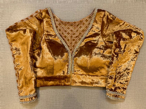 Shop golden velvet saree blouse online in USA with sheer back. Elevate your saree style with exquisite readymade saree blouses, embroidered saree blouses, Banarasi sari blouse, designer saree blouse, choli-cut blouse, corset blouses from Pure Elegance Indian fashion store in USA.-full view