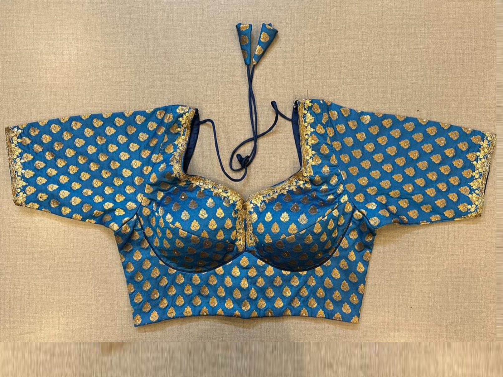 Buy blue Banarasi saree blouse online in USA with sequin lace. Elevate your saree style with exquisite readymade saree blouses, embroidered saree blouses, Banarasi sari blouse, designer saree blouse, choli-cut blouse, corset blouses from Pure Elegance Indian fashion store in USA.-full view