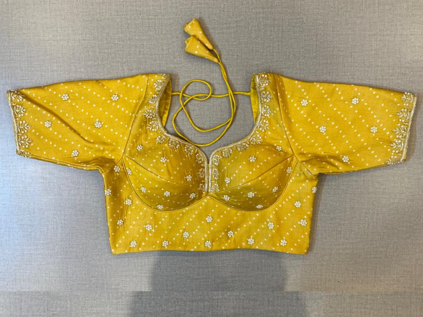 Buy yellow hand embroidered choli-cut saree blouse online in USA. Elevate your saree style with exquisite readymade saree blouses, embroidered saree blouses, Banarasi sari blouse, designer saree blouse, choli-cut blouse, corset blouses from Pure Elegance Indian fashion store in USA.-full view