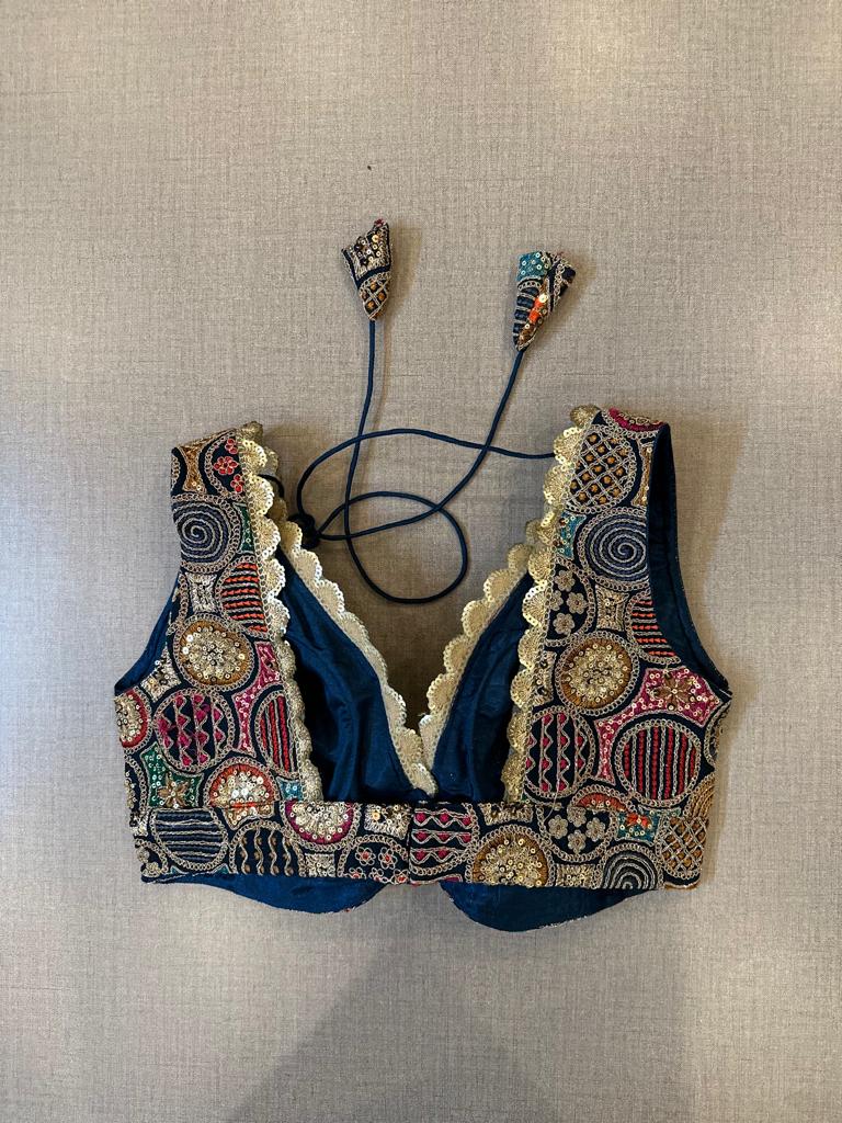 Buy navy blue multicolor embroidery sleeveless saree blouse online in USA. Elevate your saree style with exquisite readymade saree blouses, embroidered saree blouses, Banarasi sari blouse, designer saree blouse, choli-cut blouse, corset blouses from Pure Elegance Indian fashion store in USA.-back