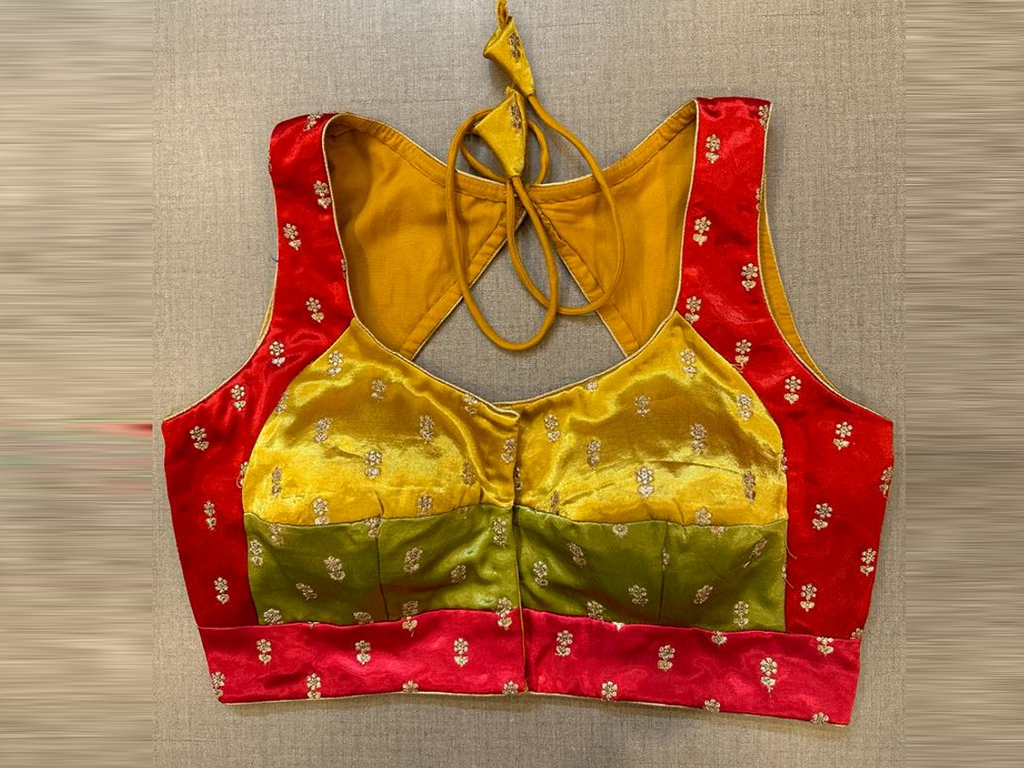Shop yellow and red embroidered choli cut saree blouse online in USA. Elevate your saree style with exquisite readymade saree blouses, embroidered saree blouses, Banarasi sari blouse, designer saree blouse, choli-cut blouse, corset blouses from Pure Elegance Indian fashion store in USA.-full view