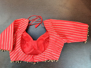 Buy beautiful red gota work designer sari blouse online in USA. Elevate your Indian saree style with exquisite readymade sari blouse, embroidered saree blouses, Banarasi sari blouse, designer sari blouse from Pure Elegance Indian clothing store in USA.-back