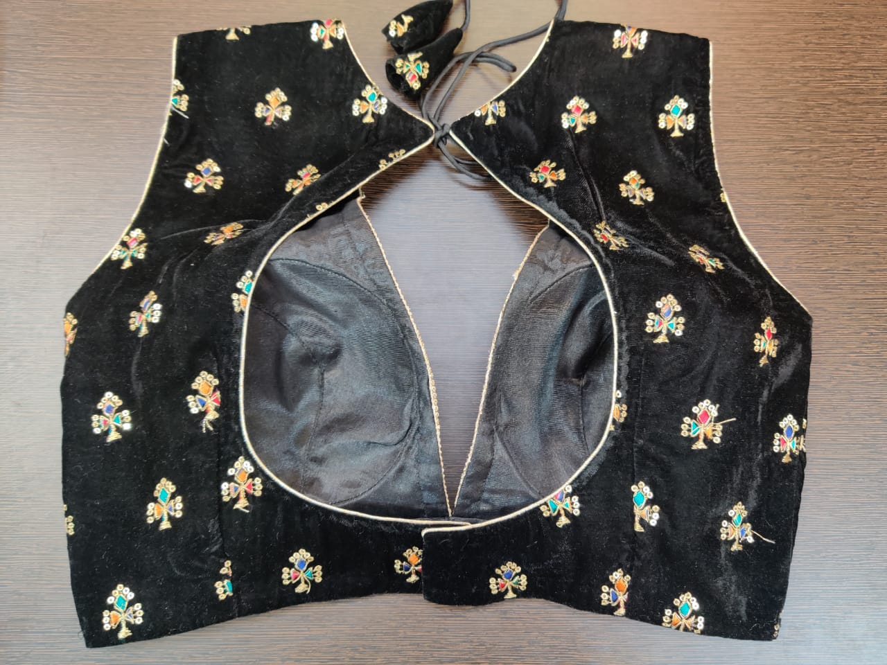 Buy stunning black embroidered sleeveless saree blouse online in USA. Elevate your Indian saree style with exquisite readymade sari blouse, embroidered saree blouses, Banarasi sari blouse, designer sari blouse from Pure Elegance Indian clothing store in USA.-back