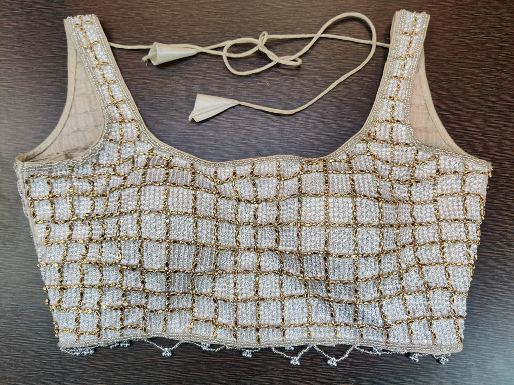 Shop stunning silver embroidered sleeveless sari blouse online in USA. Elevate your Indian saree style with exquisite readymade sari blouse, embroidered saree blouses, Banarasi sari blouse, designer sari blouse from Pure Elegance Indian clothing store in USA.-front