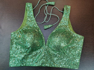 Buy stunning green sequin work sleeveless saree blouse online in USA. Elevate your Indian saree style with exquisite readymade sari blouse, embroidered saree blouses, Banarasi sari blouse, designer sari blouse from Pure Elegance Indian clothing store in USA.-front