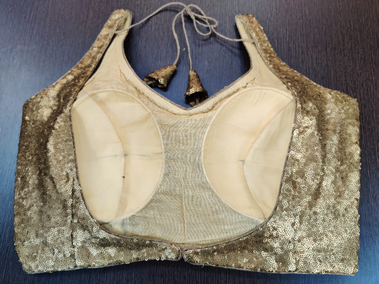 Buy stunning dull golden sequin sleeveless designer sari blouse online in USA. Elevate your Indian ethnic saree looks with exquisite readymade saree blouse, embroidered saree blouses, Banarasi sari blouse, designer saree blouse from Pure Elegance Indian clothing store in USA.-back