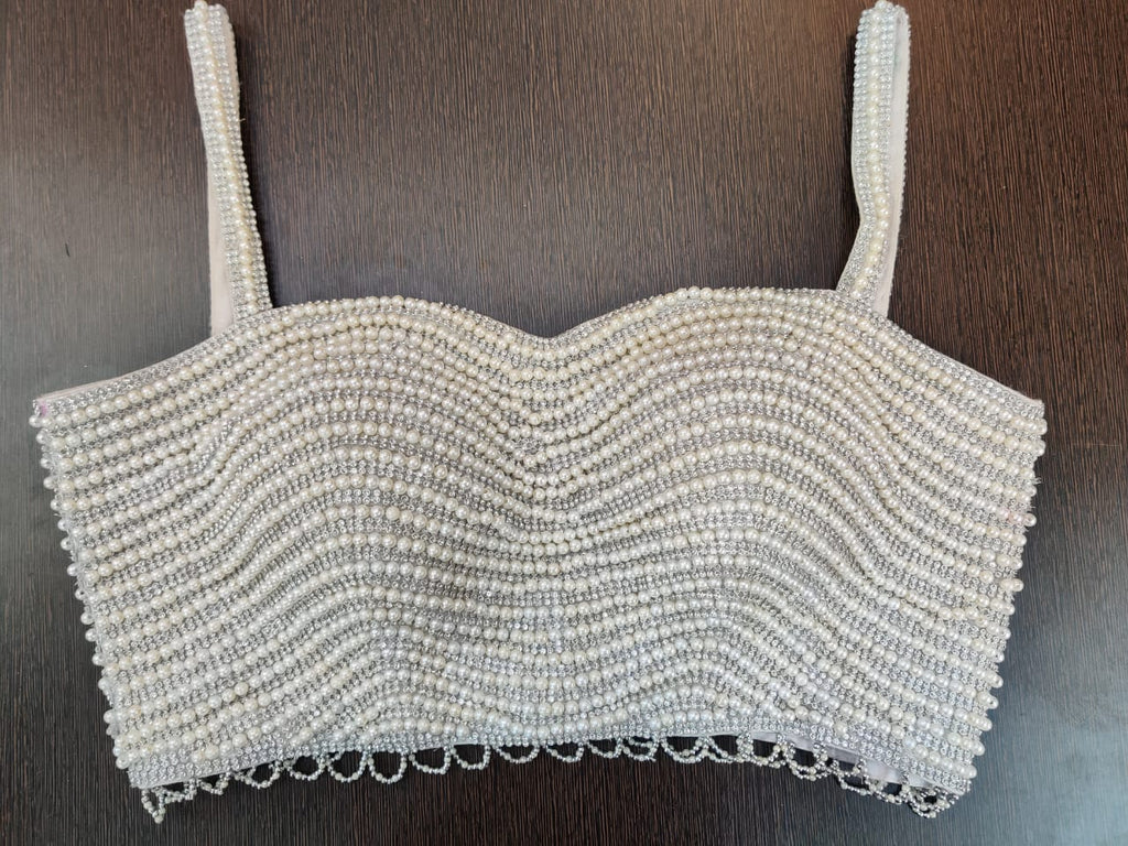 Buy stunning light grey pearl embroidery strappy sari blouse online in USA. Elevate your Indian ethnic saree looks with exquisite readymade saree blouse, embroidered saree blouses, Banarasi sari blouse, designer saree blouse from Pure Elegance Indian clothing store in USA.-front