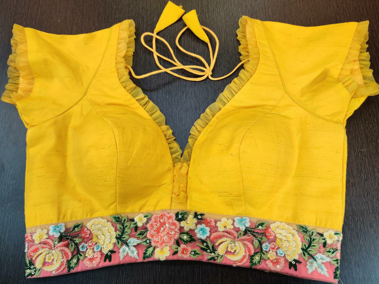 Shop beautiful yellow sari blouse online in USA with pink embroidered border. Elevate your Indian ethnic sari looks with exquisite readymade saree blouse, embroidered saree blouses, Banarasi sari blouse, designer saree blouse from Pure Elegance Indian clothing store in USA.-front