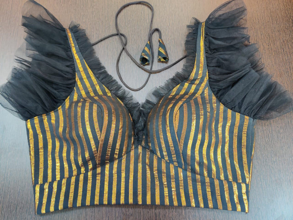 Buy stunning black and golden stripes sari blouse online in USA with frill sleeves. Elevate your Indian ethnic sari looks with exquisite readymade saree blouse, embroidered saree blouses, Banarasi sari blouse, designer saree blouse from Pure Elegance Indian clothing store in USA.-front