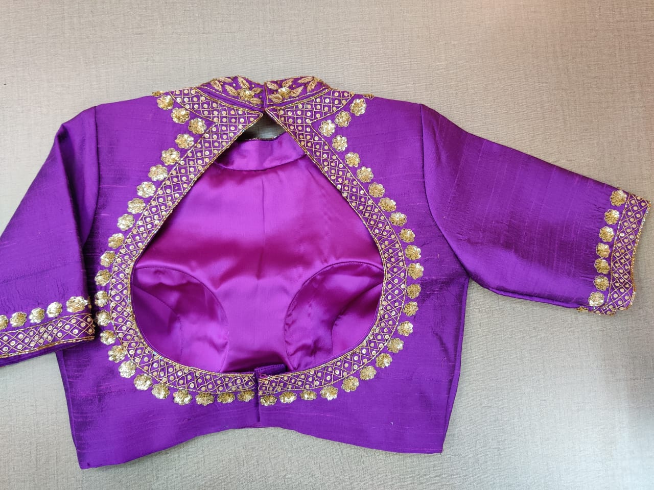 Buy stunning purple embroidered designer sari blouse online in USA. Elevate your Indian ethnic sari looks with exquisite readymade saree blouse, embroidered saree blouses, Banarasi sari blouse, designer saree blouse from Pure Elegance Indian clothing store in USA.-back
