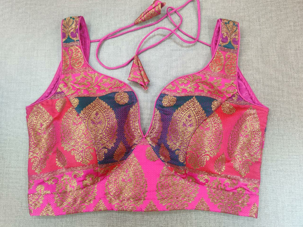 Shop stunning pink Banarasi sleeveless saree blouse online in USA. Elevate your Indian ethnic sari looks with exquisite readymade saree blouse, embroidered saree blouses, Banarasi sari blouse, designer saree blouse from Pure Elegance Indian clothing store in USA.-front