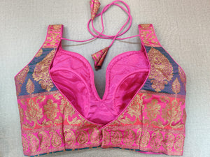 Shop stunning pink Banarasi sleeveless saree blouse online in USA. Elevate your Indian ethnic sari looks with exquisite readymade saree blouse, embroidered saree blouses, Banarasi sari blouse, designer saree blouse from Pure Elegance Indian clothing store in USA.-back