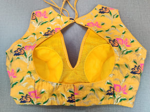 Shop stunning yellow Banarasi sleeveless saree blouse online in USA. Elevate your Indian ethnic sari looks with exquisite readymade saree blouse, embroidered saree blouses, Banarasi sari blouse, designer saree blouse from Pure Elegance Indian clothing store in USA.-back