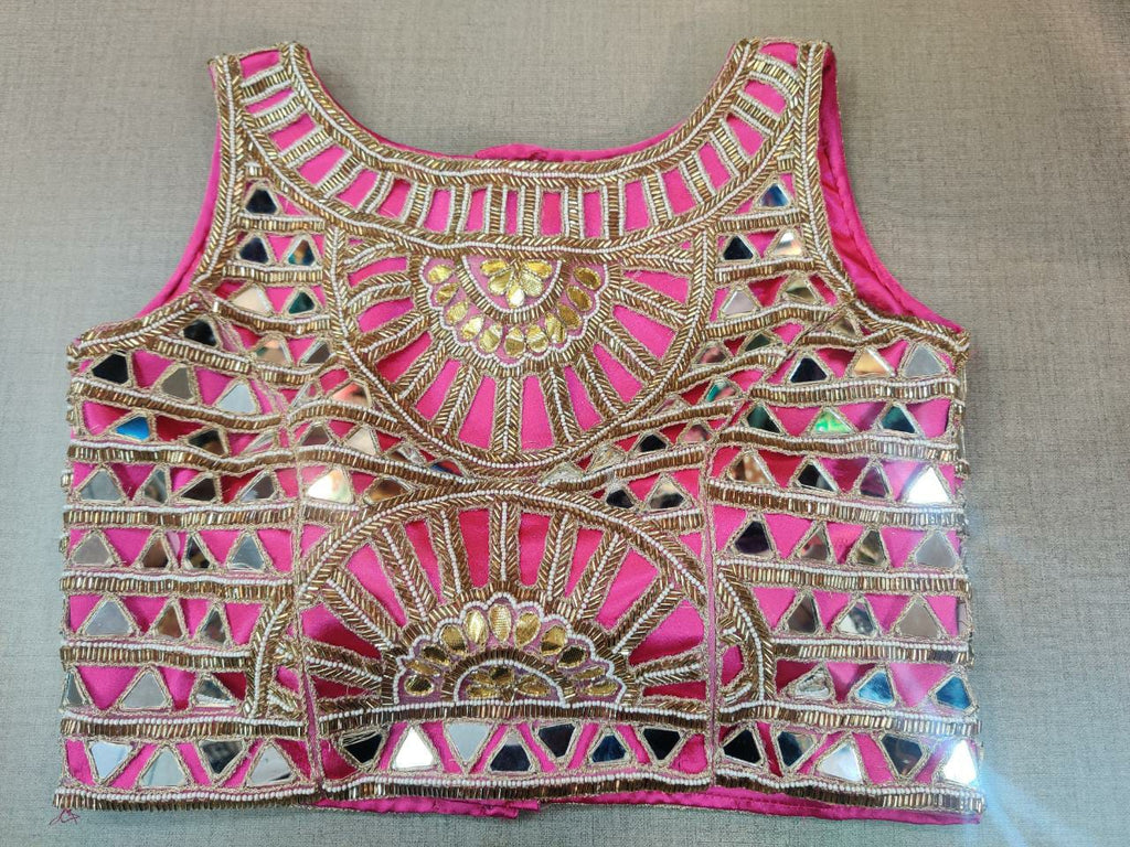 Shop gorgeous pink and golden mirror work sleeveless saree blouse online in USA. Elevate your Indian ethnic sari looks with exquisite readymade saree blouse, embroidered saree blouses, Banarasi sari blouse, designer saree blouse from Pure Elegance Indian clothing store in USA.-full view
