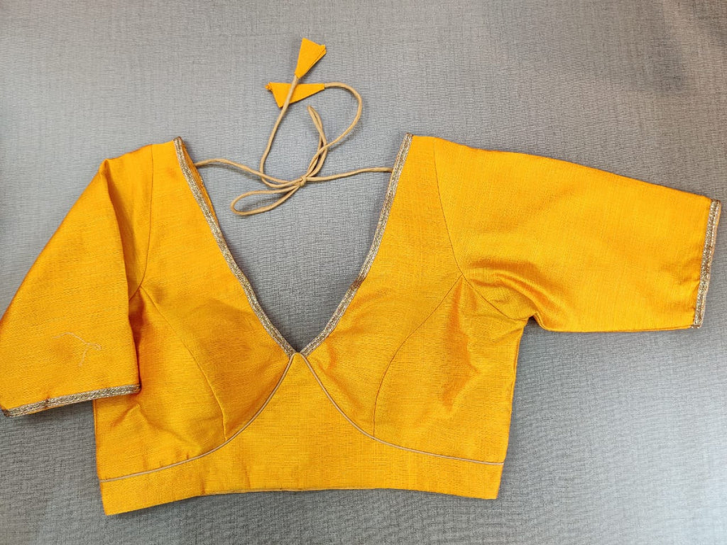 Buy beautiful mango yellow readymade saree blouse online in USA. Elevate your Indian ethnic sari looks with exquisite readymade saree blouse, embroidered saree blouses, Banarasi sari blouse, designer saree blouse from Pure Elegance Indian clothing store in USA.-front