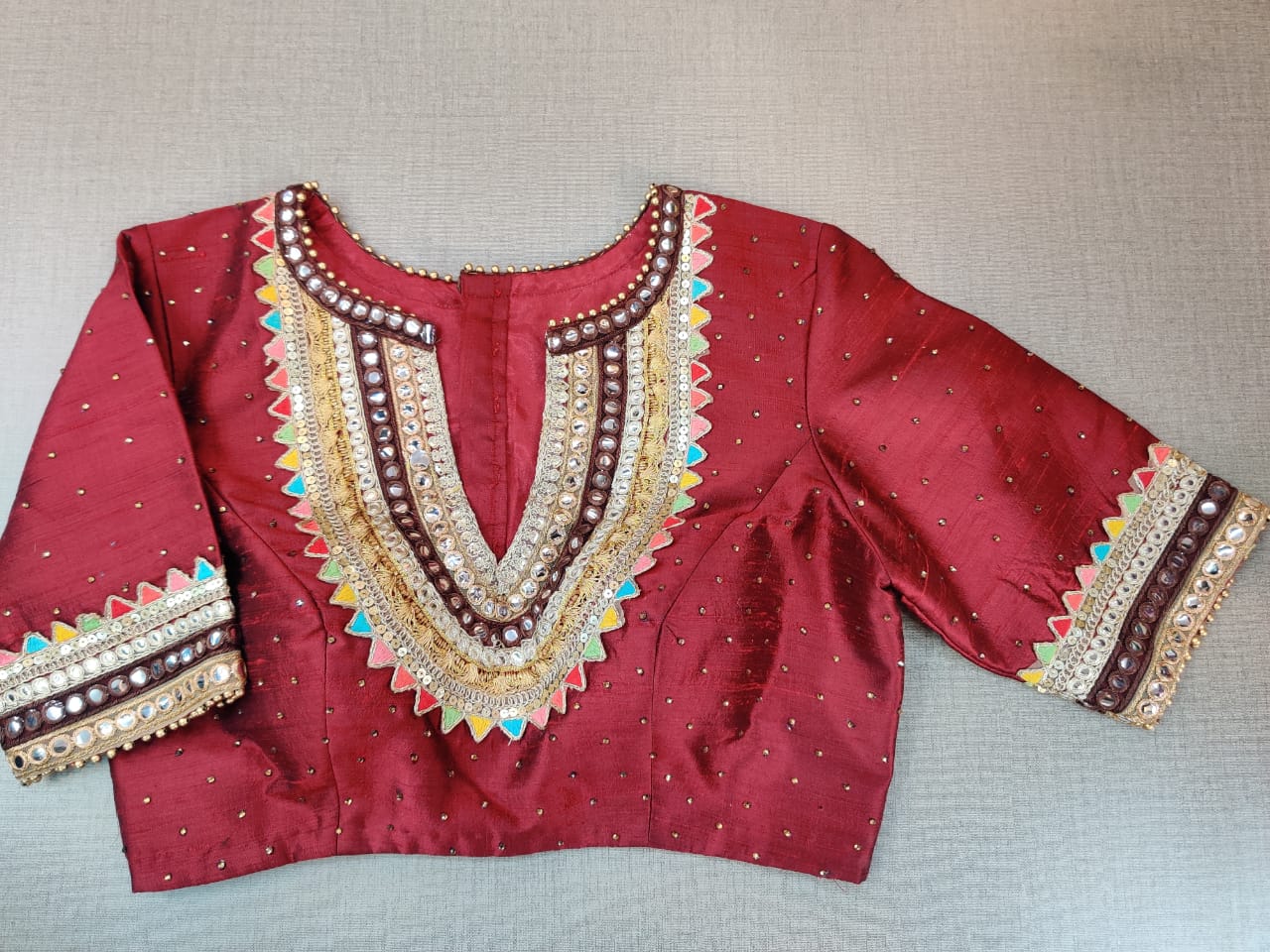 Shop beautiful maroon embroidered saree blouse online in USA with mirror work. Elevate your Indian ethnic sari looks with exquisite readymade saree blouse, embroidered saree blouses, Banarasi saree blouse, designer saree blouse from Pure Elegance Indian clothing store in USA-full view