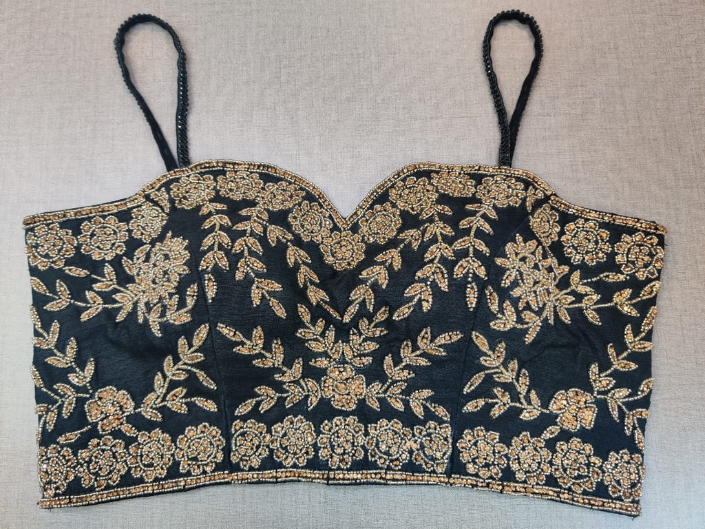 Buy beautiful black strappy saree blouse online in USA with golden embroidery. Elevate your Indian ethnic saree looks with beautiful readymade sari blouse, embroidered saree blouses, Banarasi sari blouse, designer saree blouse from Pure Elegance Indian clothing store in USA.-front