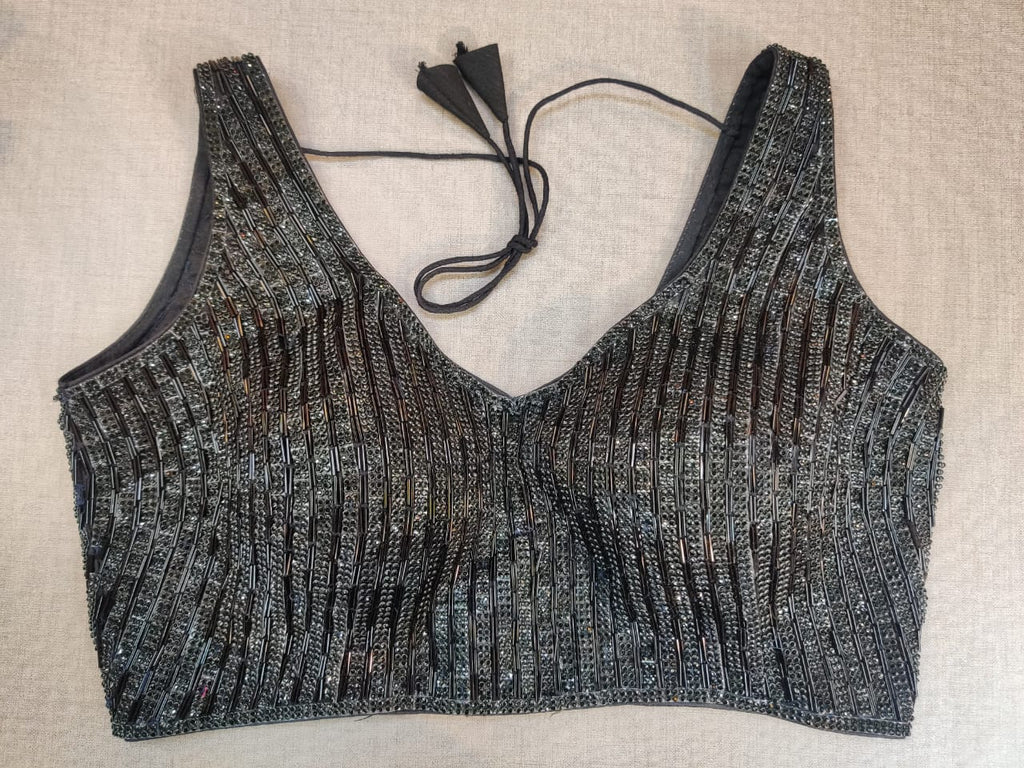 Buy stunning black bead work sleeveless saree blouse online in USA. Elevate your Indian ethnic saree looks with beautiful readymade sari blouse, embroidered saree blouses, Banarasi saree blouse, designer saree blouse from Pure Elegance Indian clothing store in USA.-front