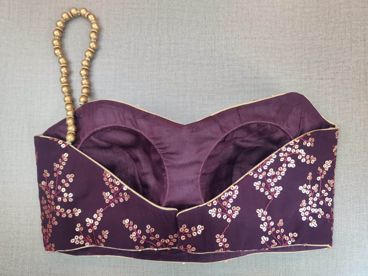 Shop beautiful purple embroidered saree blouse online in USA with one shoulder strap. Elevate your Indian ethnic saree looks with beautiful readymade saree blouse, embroidered saree blouses, Banarasi saree blouse, designer saree blouse from Pure Elegance Indian clothing store in USA.-back