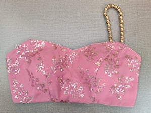 Buy stunning dusty pink embroidered saree blouse online in USA with one shoulder strap. Elevate your Indian ethnic saree looks with beautiful readymade saree blouse, embroidered saree blouses, Banarasi saree blouse, designer saree blouse from Pure Elegance Indian clothing store in USA.-front