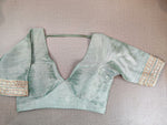 Shop gorgeous pastel green embroidered saree blouse online in USA with one shoulder strap. Elevate your Indian ethnic saree looks with beautiful readymade saree blouse, embroidered saree blouses, Banarasi saree blouse, designer saree blouse from Pure Elegance Indian clothing store in USA.-full view