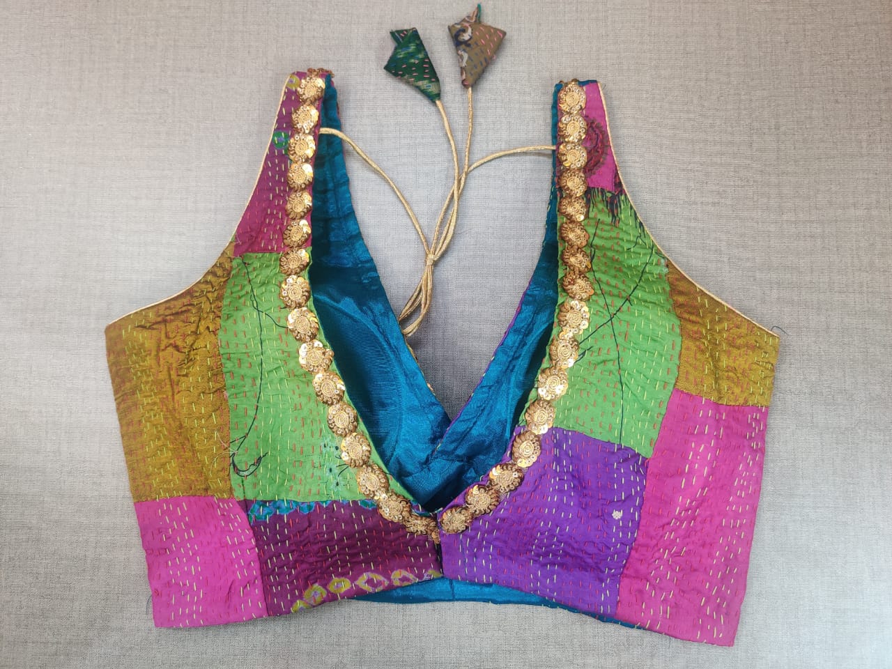 Shop beautiful multicolor patch work Kantha work saree blouse online in USA. Elevate your Indian ethnic saree looks with beautiful readymade saree blouse, embroidered saree blouses, Banarasi saree blouse, designer sari blouse from Pure Elegance Indian fashion store in USA.-back