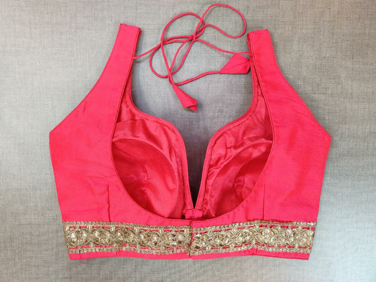 Buy stunning pink sleeveless saree blouse online in USA with lace border. Elevate your Indian ethnic saree looks with beautiful readymade saree blouse, embroidered saree blouses, Banarasi saree blouse, designer saree blouses from Pure Elegance Indian fashion store in USA.-back