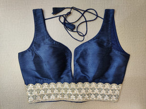 Shop stunning dark blue sleeveless saree blouse online in USA with lace border. Elevate your Indian ethnic saree looks with beautiful readymade saree blouse, embroidered saree blouses, Banarasi saree blouse, designer saree blouses from Pure Elegance Indian fashion store in USA.-front