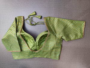 Buy stunning green and golden readymade saree blouse online in USA. Elevate your Indian ethnic saree looks with beautiful readymade saree blouse, embroidered saree blouses, Banarasi saree blouse, designer saree blouses from Pure Elegance Indian fashion store in USA.-back