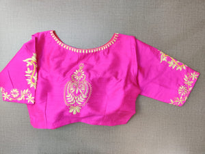 Buy stunning neon pink saree blouse online in USA with embroidered motifs. Elevate your Indian ethnic saree looks with beautiful readymade saree blouse, embroidered saree blouses, Banarasi saree blouse, designer saree blouses from Pure Elegance Indian fashion store in USA.-back
