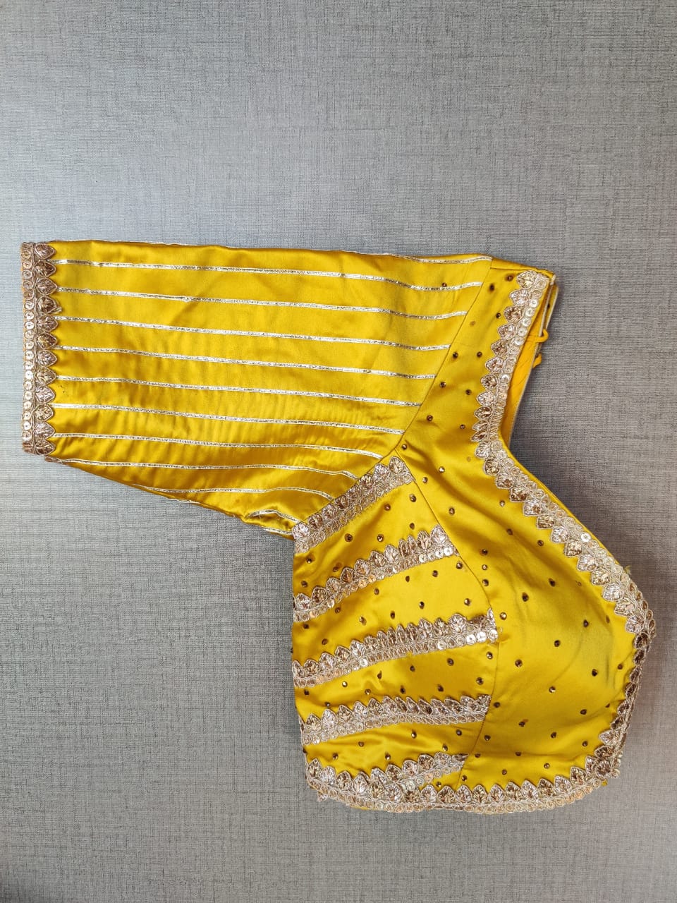 Buy stunning yellow readymade saree blouse online in USA with heavy embroidery. Elevate your Indian ethnic saree looks with beautiful readymade saree blouse, embroidered saree blouses, Banarasi saree blouse, designer saree blouses from Pure Elegance Indian fashion store in USA.-sleeves