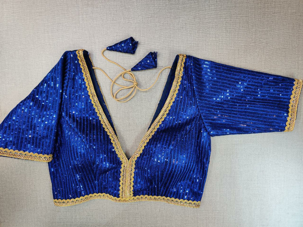 Shop gorgeous blue sequin work saree blouse online in USA with golden lace. Elevate your Indian ethnic saree looks with beautiful readymade saree blouse, embroidered saree blouses, Banarasi saree blouse, designer saree blouses from Pure Elegance Indian fashion store in USA.-front