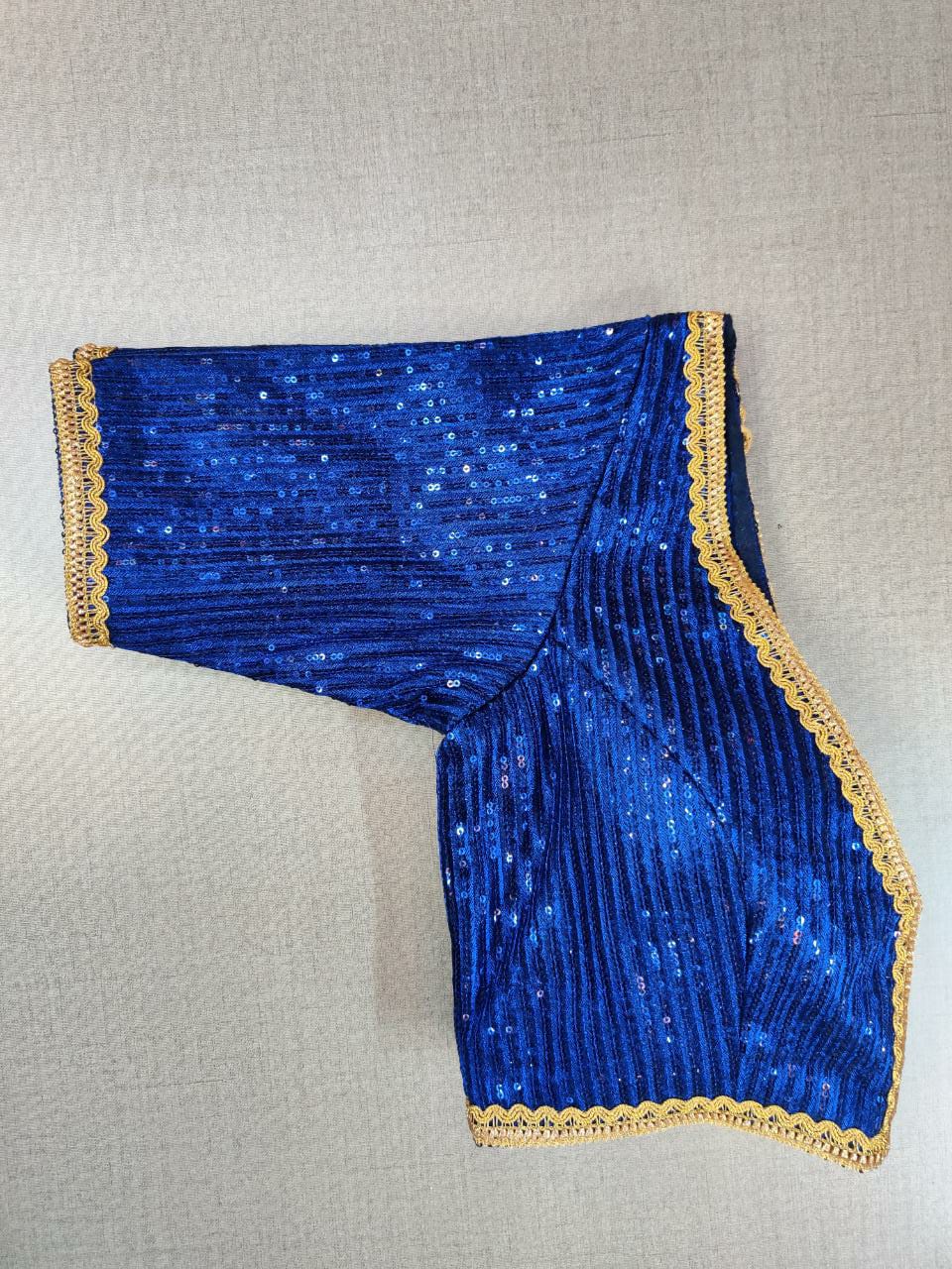 Shop gorgeous blue sequin work saree blouse online in USA with golden lace. Elevate your Indian ethnic saree looks with beautiful readymade saree blouse, embroidered saree blouses, Banarasi saree blouse, designer saree blouses from Pure Elegance Indian fashion store in USA.-sleeves