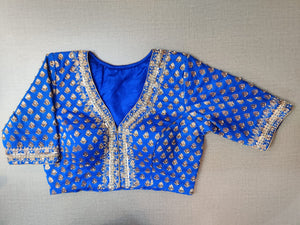 Shop gorgeous electric blue embroidered Banarasi saree blouse online in USA. Elevate your Indian ethnic saree looks with beautiful readymade sari blouse, embroidered saree blouses, Banarasi saree blouse, designer sari blouses, sleeveless saree blouses from Pure Elegance Indian fashion store in USA.-front