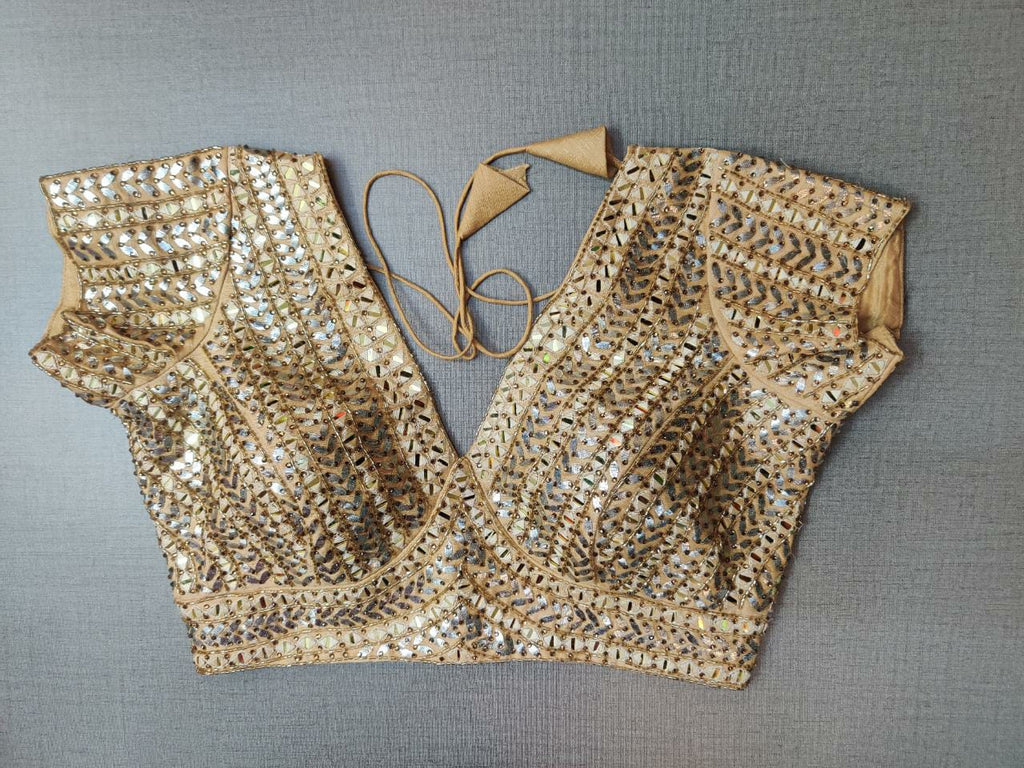 Shop stunning golden gota work embroidered sari blouse online in USA. Elevate your Indian ethnic saree looks with beautiful readymade sari blouse, embroidered saree blouses, Banarasi saree blouse, designer sari blouses, sleeveless saree blouses from Pure Elegance Indian fashion store in USA.-front