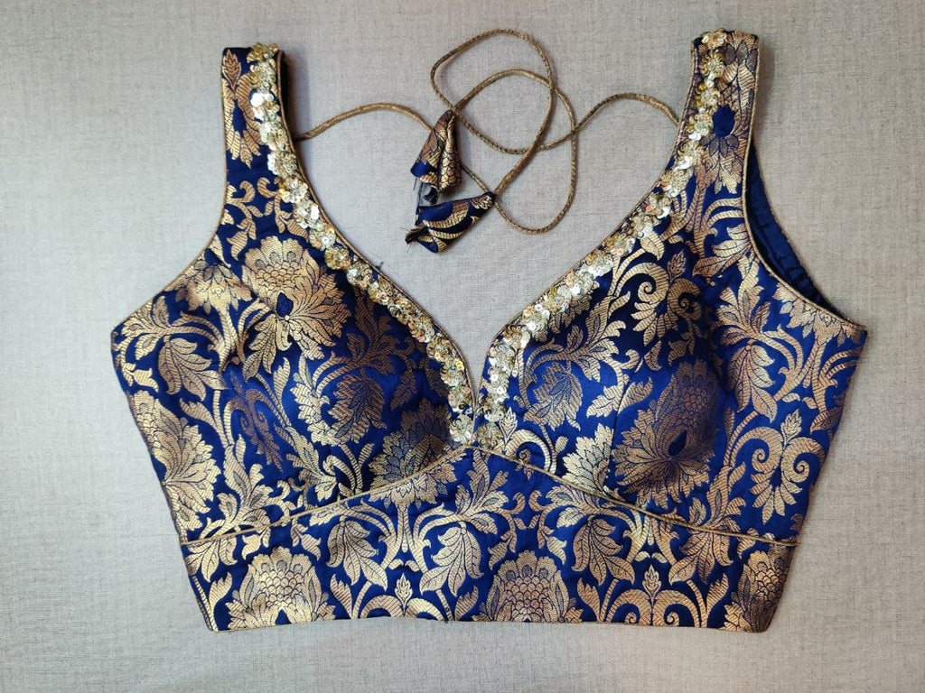 Shop stunning roya blue embroidered sari blouse online in USA. Elevate your Indian ethnic saree looks with beautiful readymade sari blouse, embroidered saree blouses, Banarasi saree blouse, designer sari blouses, sleeveless saree blouses from Pure Elegance Indian fashion store in USA.-front