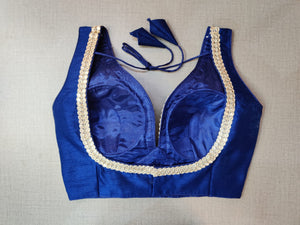 Buy beautiful dark blue sleeveless saree blouse online in USA with silver embroidery lace. Elevate your Indian ethnic saree looks with beautiful readymade sari blouse, embroidered saree blouses, Banarasi saree blouse, designer sari blouses, sleeveless saree blouses from Pure Elegance Indian fashion store in USA.-back