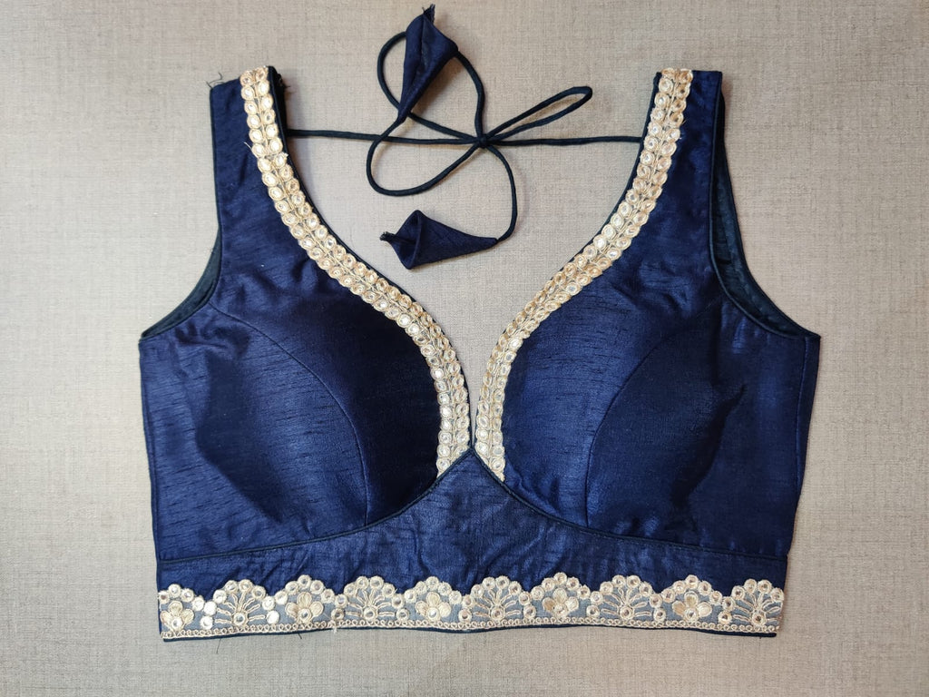 Shop stunning navy blue sleeveless saree blouse online in USA with silver embroidery lace. Elevate your Indian ethnic saree looks with beautiful readymade sari blouse, embroidered saree blouses, Banarasi saree blouse, designer sari blouses, sleeveless saree blouses from Pure Elegance Indian fashion store in USA.-front