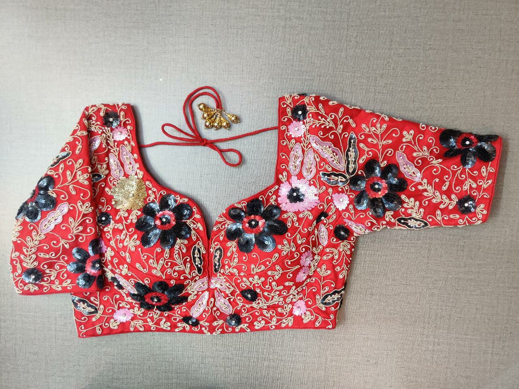 Buy beautiful red designer sari blouse online in USA with heavy embroidery. Elevate your Indian ethnic saree looks with beautiful readymade sari blouse, embroidered saree blouses, Banarasi saree blouse, designer saree blouses, sleeveless saree blouses from Pure Elegance Indian fashion store in USA.-front