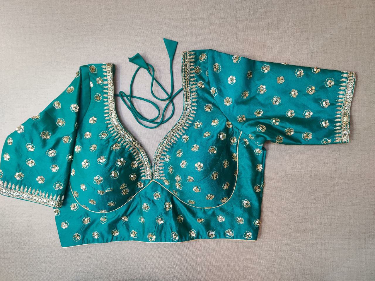 Buy stunning sea green embroidered designer saree blouse online in USA. Elevate your Indian ethnic saree looks with beautiful readymade sari blouse, embroidered saree blouses, Banarasi saree blouse, designer saree blouses, sleeveless saree blouses from Pure Elegance Indian fashion store in USA.-front