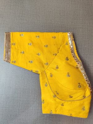 Buy yellow designer saree blouse online in USA with embroidery. Elevate your Indian ethnic saree looks with beautiful readymade sari blouse, embroidered saree blouses, Banarasi saree blouse, designer saree blouses, sleeveless saree blouses from Pure Elegance Indian fashion store in USA.-sleeves