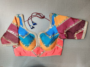 Shop beautiful multicolor pattern saree blouse online in USA with golden highlights. Elevate your Indian ethnic saree looks with beautiful readymade sari blouse, embroidered saree blouses, Banarasi saree blouse, designer saree blouses, sleeveless saree blouses from Pure Elegance Indian fashion store in USA.-front