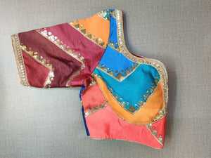Shop beautiful multicolor pattern saree blouse online in USA with golden highlights. Elevate your Indian ethnic saree looks with beautiful readymade sari blouse, embroidered saree blouses, Banarasi saree blouse, designer saree blouses, sleeveless saree blouses from Pure Elegance Indian fashion store in USA.-sleeves