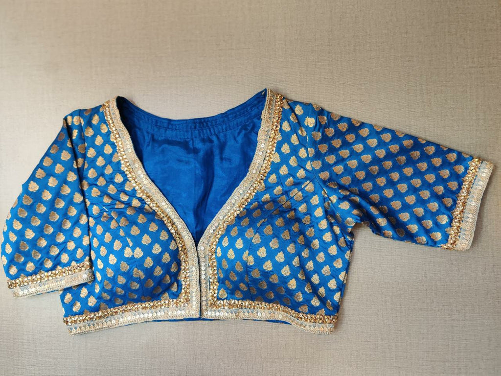 Shop stunning blue Banarasi saree blouse online in USA with embroidery. Elevate your Indian ethnic saree looks with beautiful readymade sari blouse, embroidered saree blouses, Banarasi saree blouse, designer saree blouses, sleeveless saree blouses from Pure Elegance Indian fashion store in USA.-front