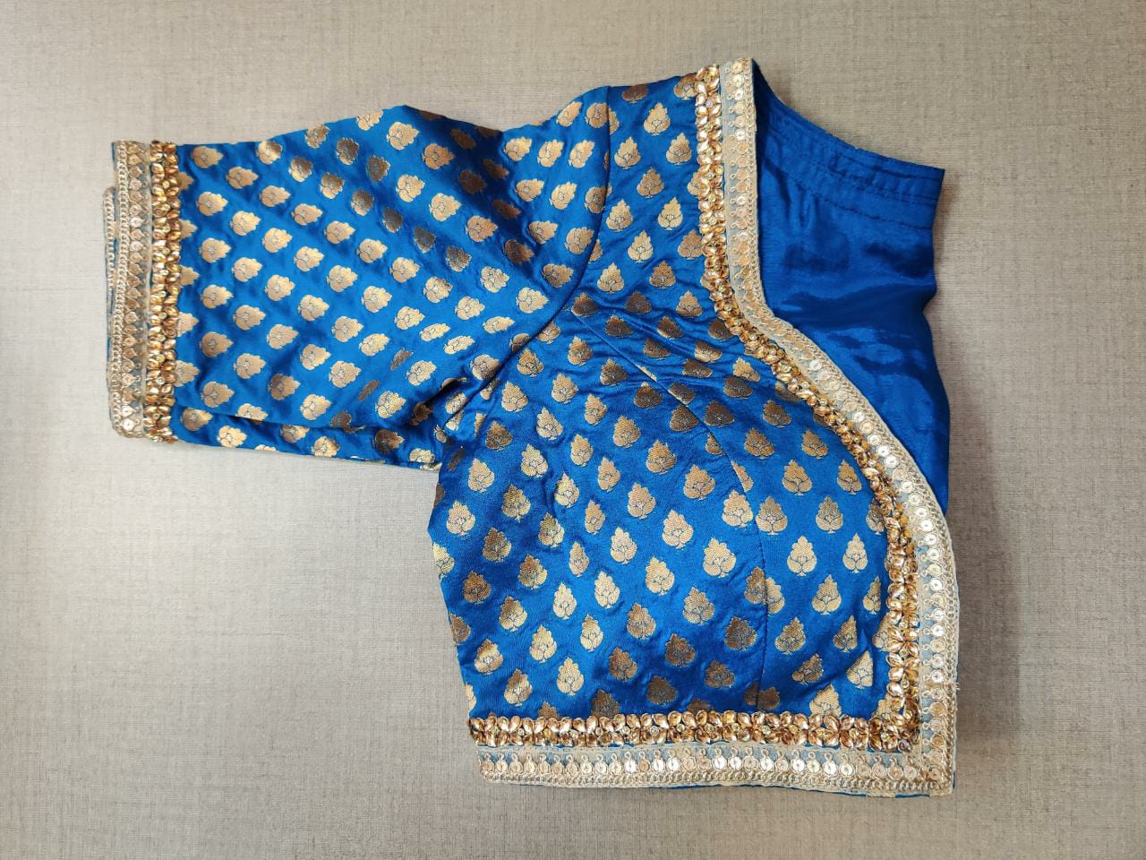 Shop stunning blue Banarasi saree blouse online in USA with embroidery. Elevate your Indian ethnic saree looks with beautiful readymade sari blouse, embroidered saree blouses, Banarasi saree blouse, designer saree blouses, sleeveless saree blouses from Pure Elegance Indian fashion store in USA.-sleeves