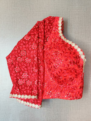 Shop beautiful red embroidered designer saree blouse online in USA with golden highlights. Elevate your Indian ethnic saree looks with beautiful readymade sari blouse, embroidered saree blouses, Banarasi saree blouse, designer saree blouses, sleeveless saree blouses from Pure Elegance Indian fashion store in USA.-sleeves